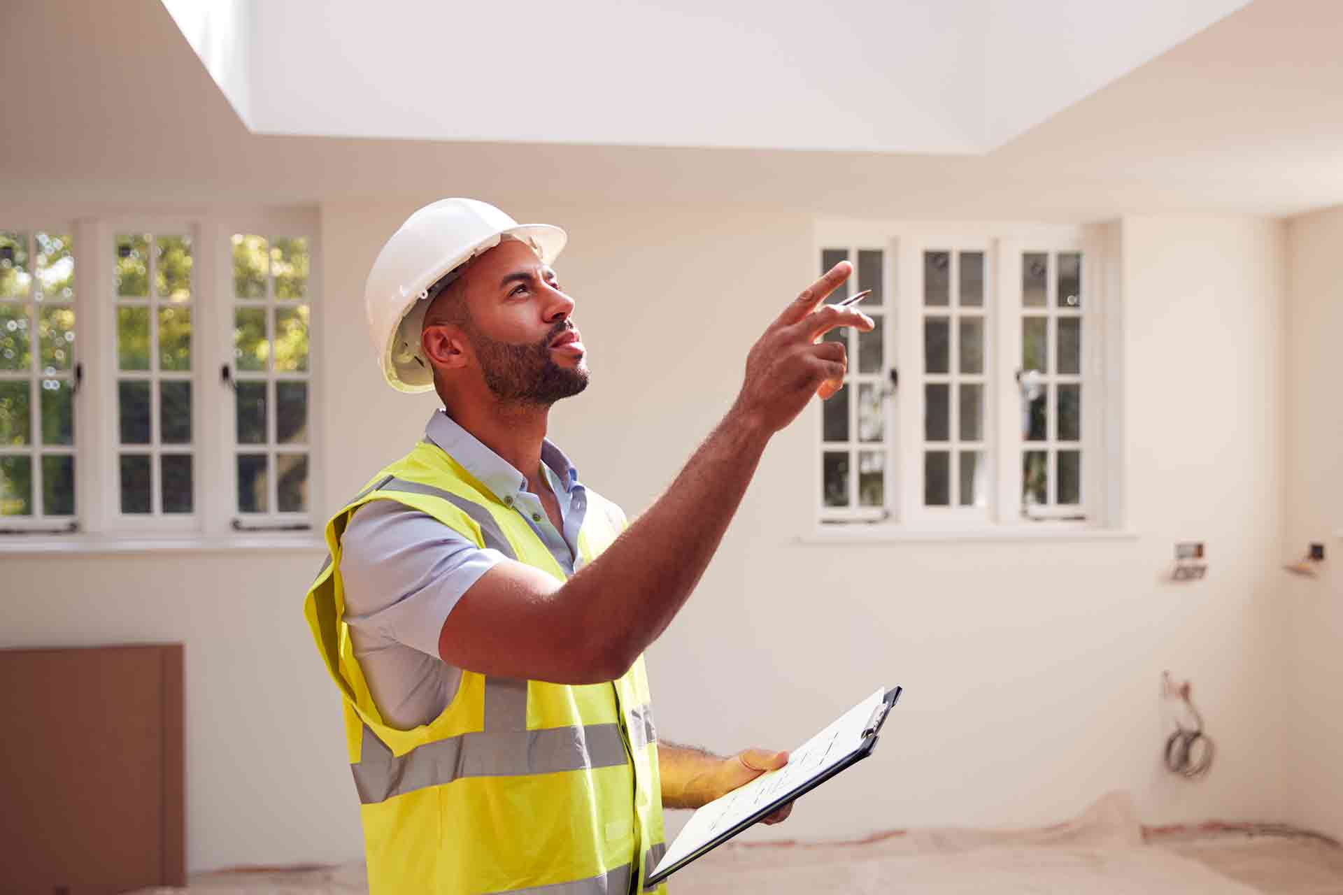 Third Party Wall Surveyors Richmond reviewing plans between two parties during a dispute